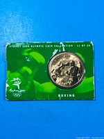 Front of blister card with coin visible