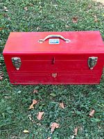 Front and top view of red Beach cantilever toolbox closed