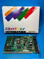 Front view of ExpertColor sound card in front of retail box
