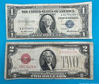 Obverse of $1 silver certificate above $2 red-seal note