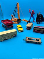group shot of all vehicles, figures, wagon and crane