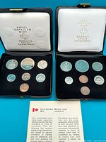 Both 1977 and 1978 specimen sets opened showing all coins and cases