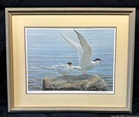 Framed lithograph showing full artwork, mat and frame