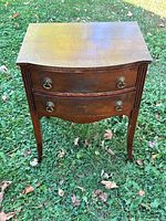 Full view of wooden two-drawer silverware chest on legs