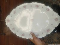 Top view of the platter showing floral pattern and scalloped rim