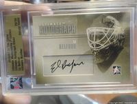 Front view of sealed Ed Belfour Ultimate Autograph Silver card showing autograph and mask design