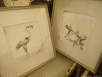 Both framed bird prints side by side showing images and frames