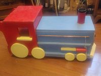 Full view of painted wooden train toy box