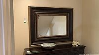 Front view of rectangular mirror on dresser