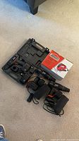 Lot overview with three drills, chargers, batteries, case and Jobmate box