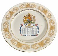 Front of Aynsley Silver Jubilee plate showing gold border, royal crest, blue text panel