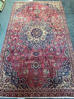 Full view of Persian Kashan rug showing overall design and colors