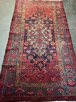 Full view of handmade Persian wool rug showing overall design and colors
