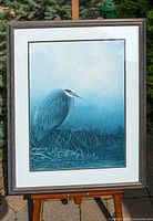 Full front view of framed print on easel