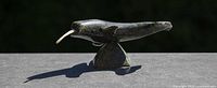 Left side view of soapstone narwhal showing tusk and base