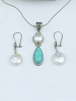 Necklace pendant and earrings close-up