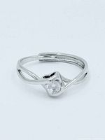 Front view of sterling silver bypass ring with clear stone