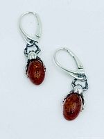 Front view of both amber spider earrings