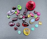 All gemstones spread out on black background