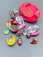 All loose gemstones on black background