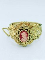 Front view showing cameo and ornate filigree setting