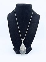 Necklace displayed on stand showing overall appearance