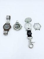 All four watches lined up side by side