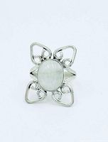 Front view of moonstone silver ring showing cabochon and ornate setting