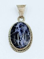 Front view showing sodalite cabochon and silver rope border