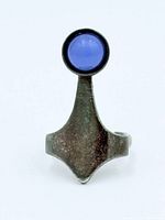 Front view showing design and blue cabochon