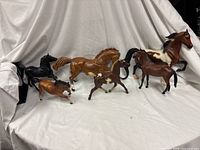 All six Breyer horse figurines grouped together
