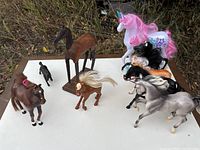 Group shot of all figures on tabletop outdoors