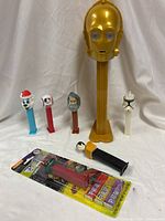 Group view showing all seven PEZ dispensers including giant C-3PO