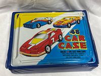 Front view of blue 48 Car Case with graphic