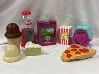 Group shot of all eight plastic pretend food items
