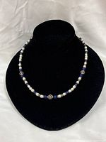 Full view of necklace on black display