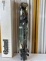 Tripod sealed in plastic next to Bushnell branded box