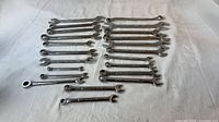 All 23 Craftsman wrenches laid out, two size rows and extras