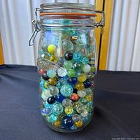 Full jar filled with assorted marbles