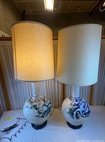 Both ceramic lamps with shades illuminated