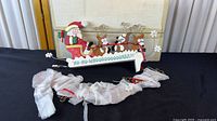 Overall view of Santa and reindeer wall hanging with protective-wrapped sections