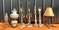 Group shot of all lamps, shade, bracket and finials