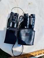 Both binoculars side by side in their cases