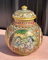 Front view of carved marble ginger jar with lid showing painted scene