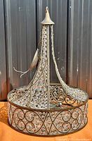 Full view of drum chandelier showing frame, crystal beads, wiring