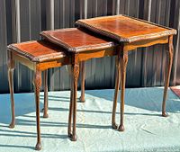 Three graduated Queen Anne nesting tables fully extended