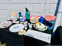 Group shot of all pottery, china and glassware items displayed on table