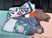 Three folded quilts stacked