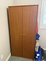 Full view of closed teak wardrobe front