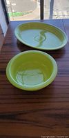 Chartreuse Fiesta oval platter and round bowl on wood surface